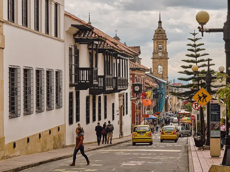 A street lined with low-rise buildings in Bogota, Colombia