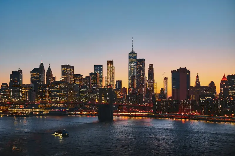Manhattan Bridge and the New York City skyline at sunset