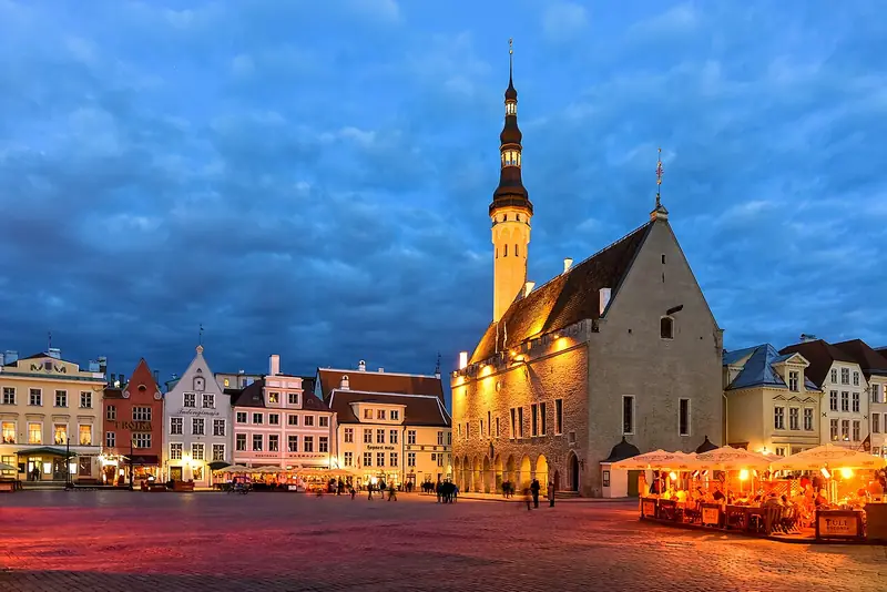 Town Hall Square illuminated at night in Tallinn, Estonia